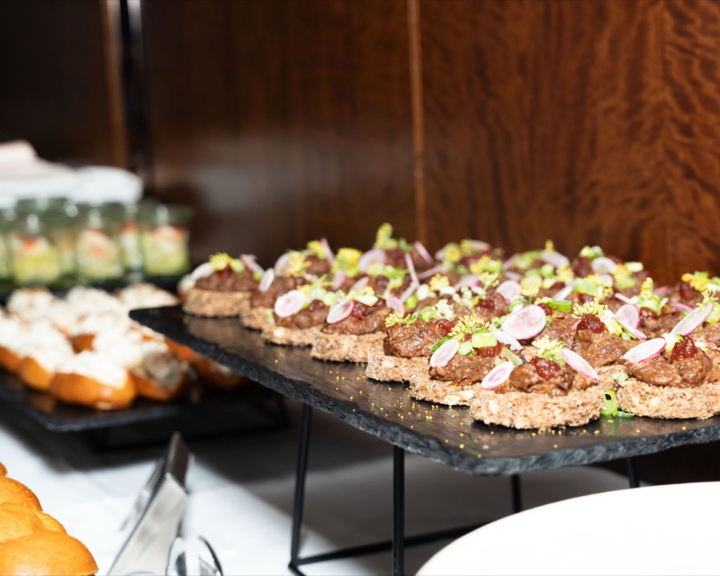 Beef tartare on seeded rye with radish and microgreens